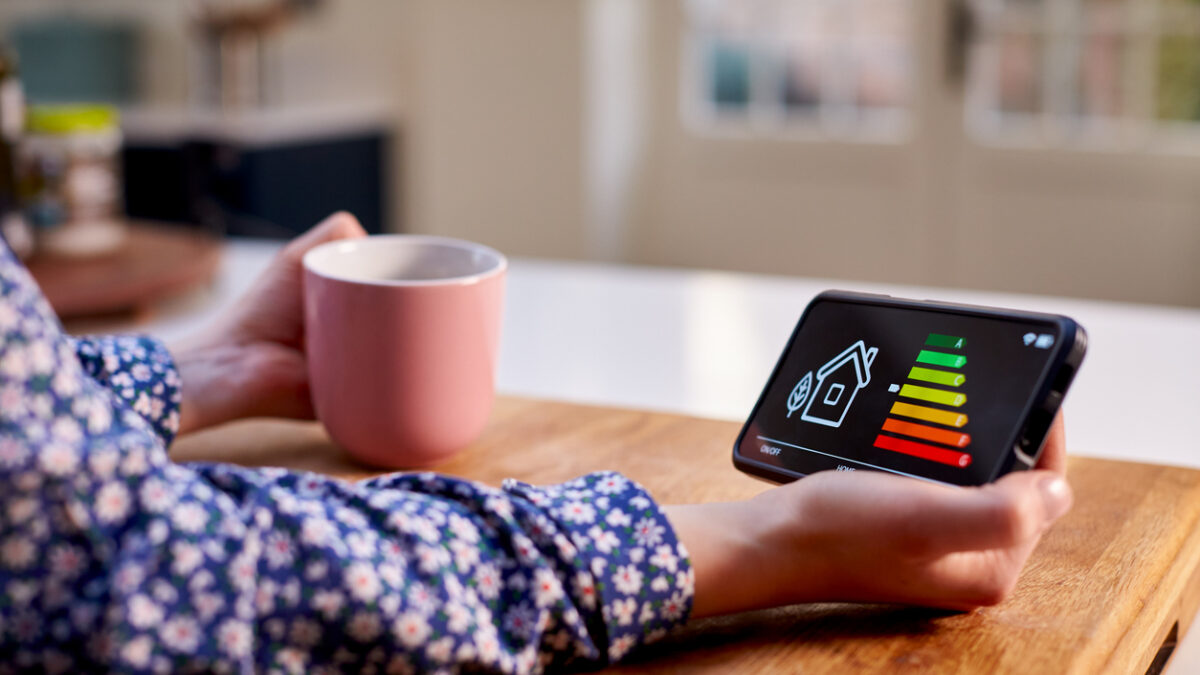 A woman holding smart energy meter