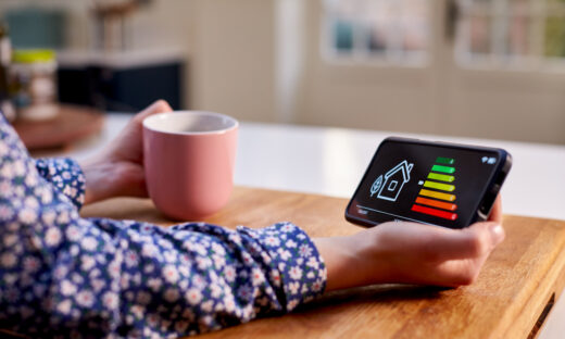 A woman holding smart energy meter