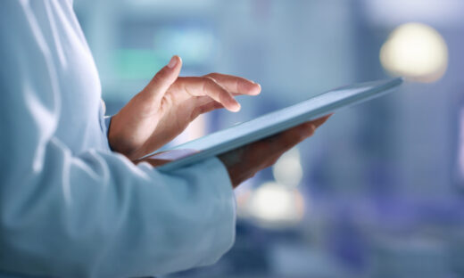 Doctor, researcher or scientist browsing the internet on a tablet for information while working at a lab, science facility or hospital. Expert, medical professional or surgeon searching the internet