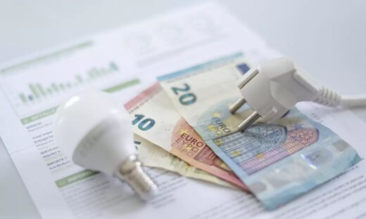 euro banknotes, a lamp and an electricity bill