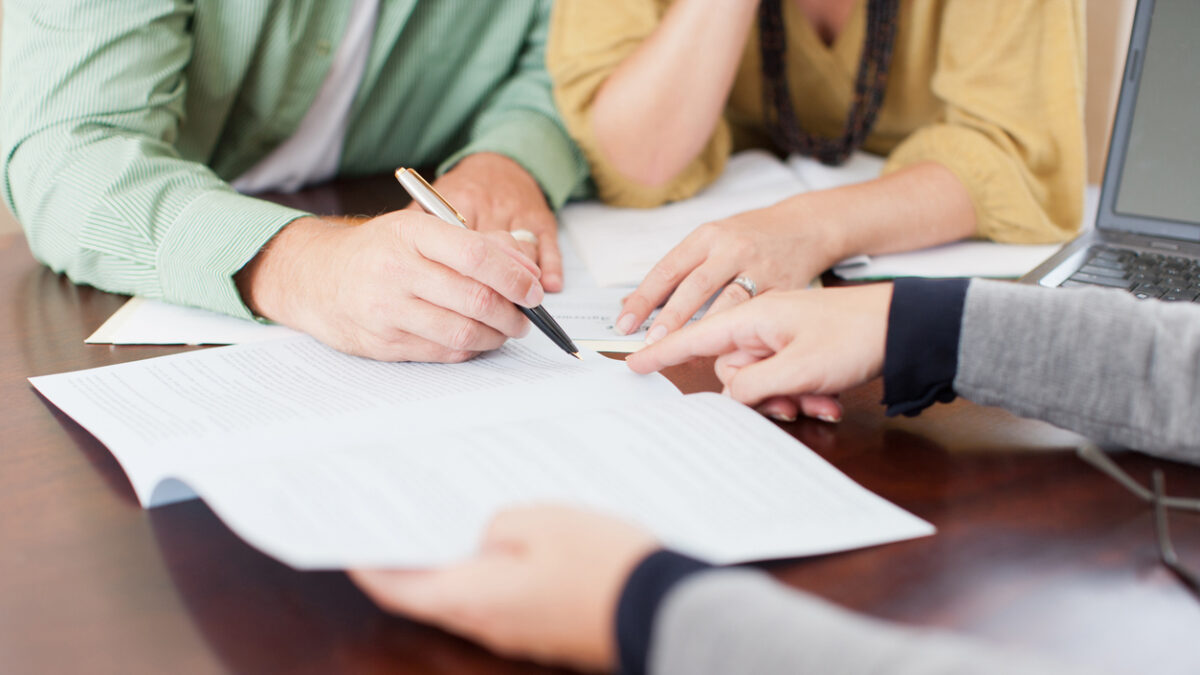 Couple signing contract