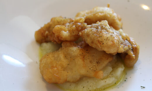 Greek cuisine: bakaliaros (fried cod) with mashed potatoes