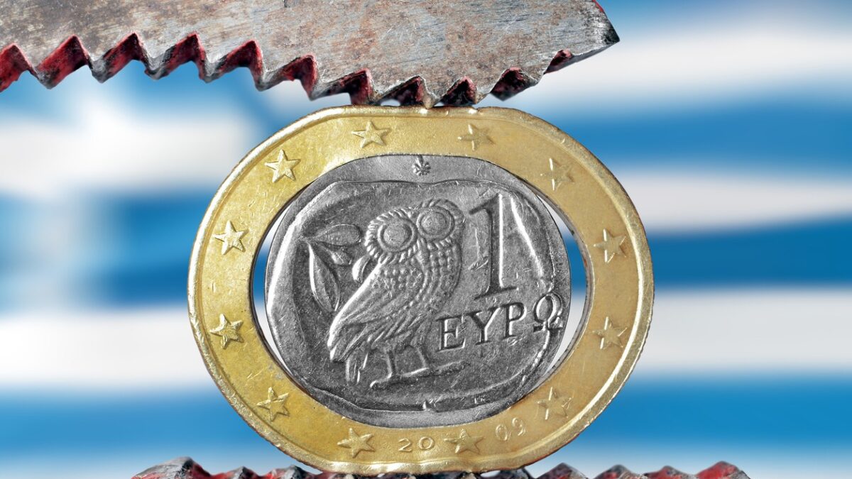 Greek euro stressed with a plier symbolizing the financial problems of the country