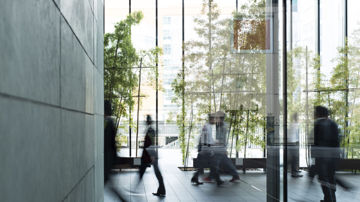 Business person walking in a urban building