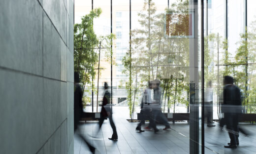 Business person walking in a urban building