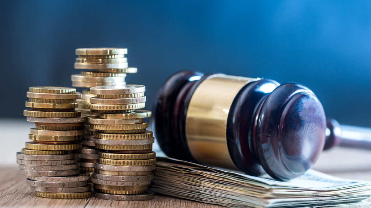 gavel with euro banknotes and coin