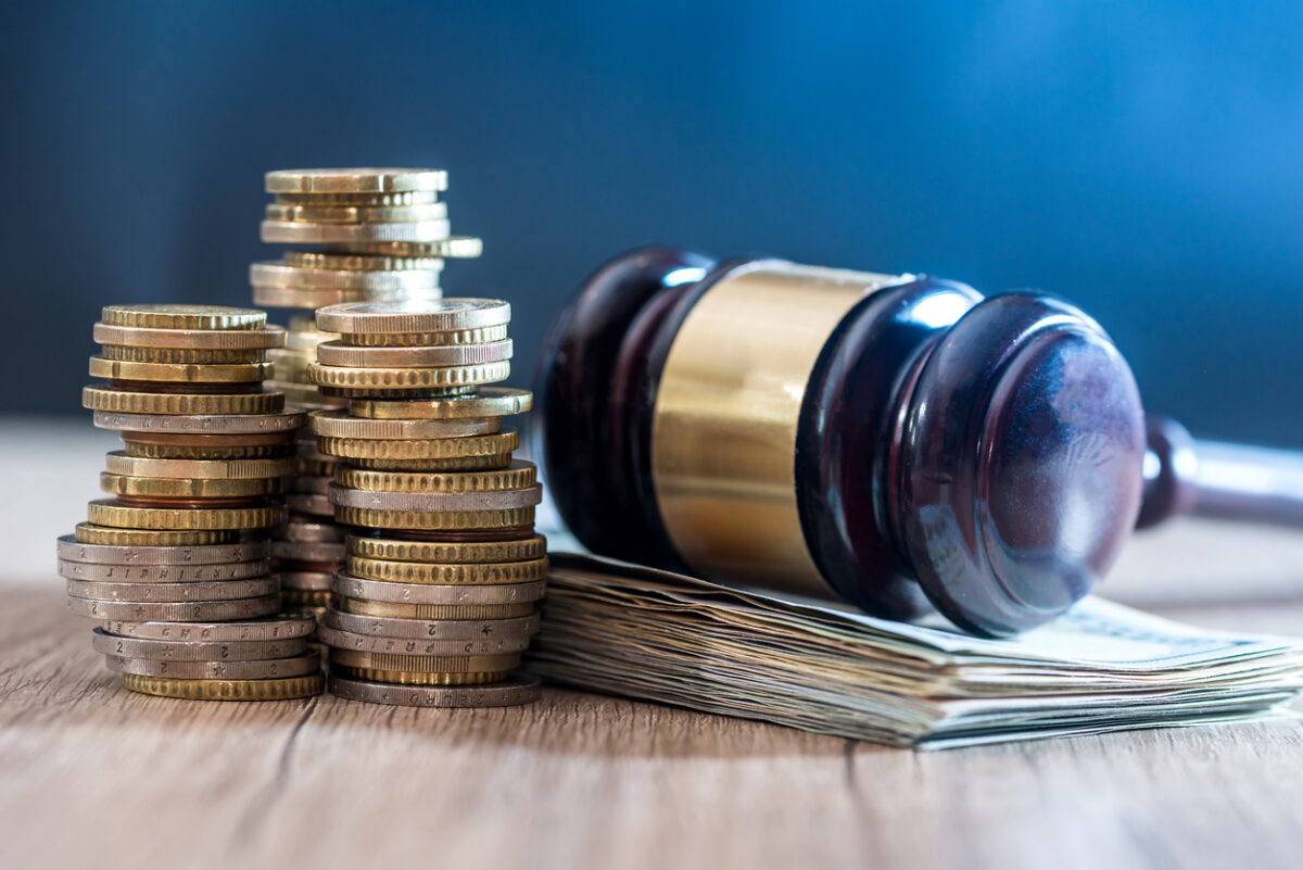 gavel with euro banknotes and coin