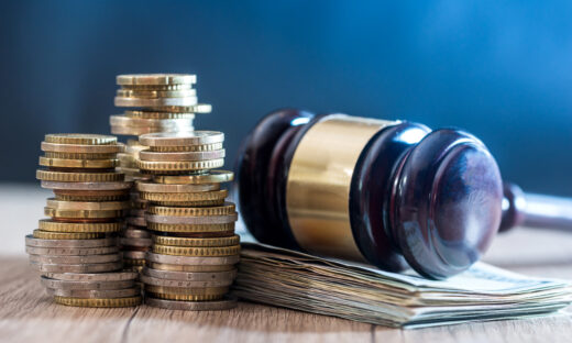 gavel with euro banknotes and coin