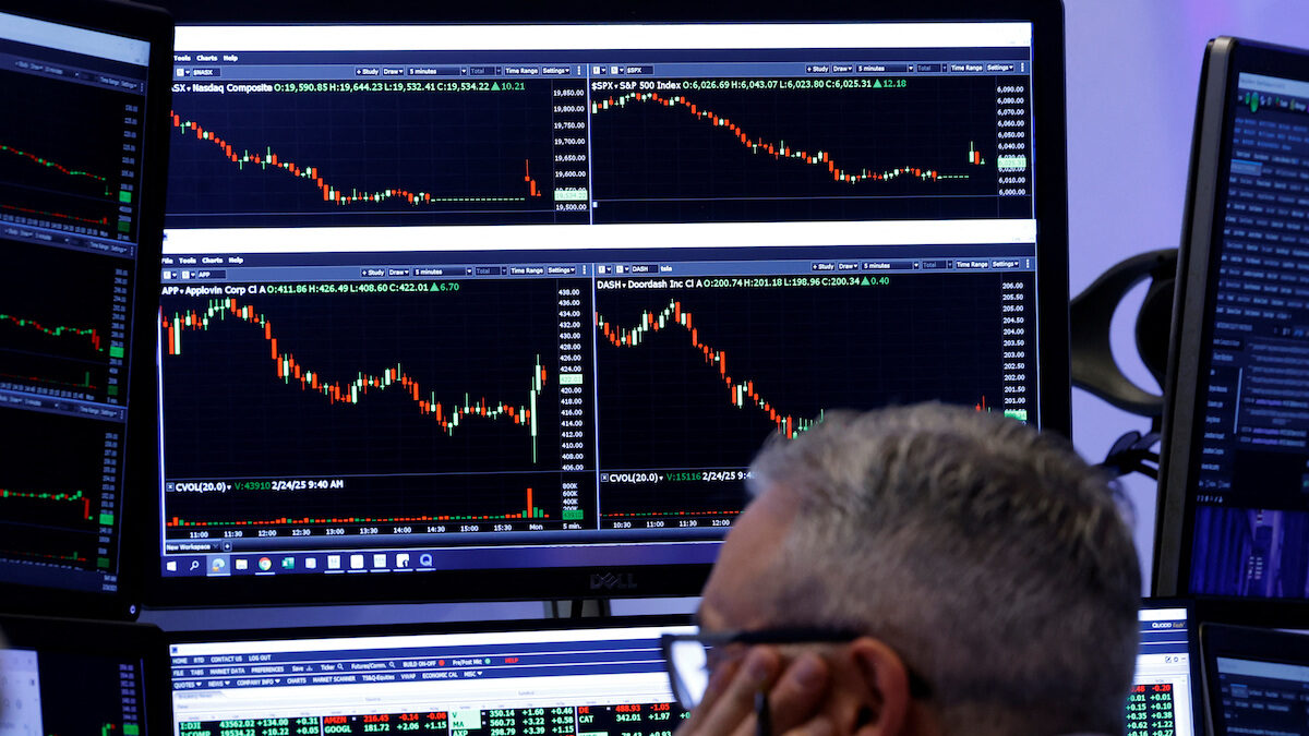 Traders work on the floor of the NYSE in New York