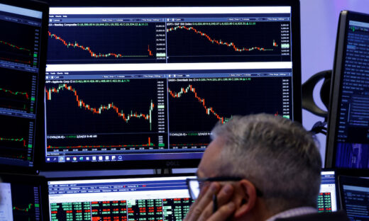 Traders work on the floor of the NYSE in New York