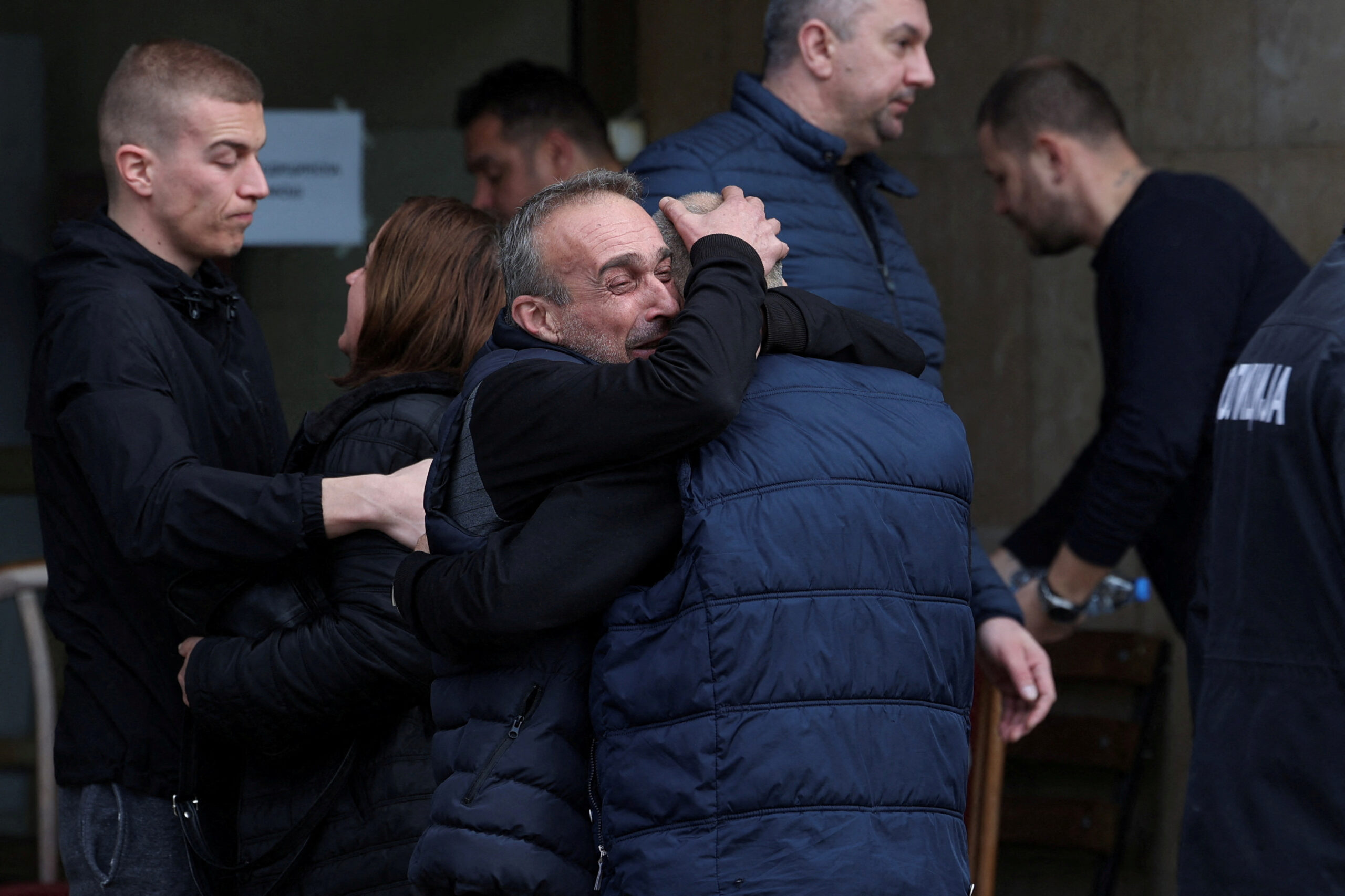 People embrace outside a hospital following a fire at the Pulse nightclub that resulted in dozens of deaths in the town of Kocani, North Macedonia, March 17, 2025. REUTERS